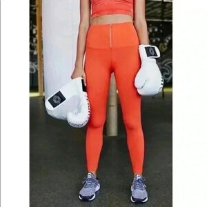 Free people movement orange zipped XS